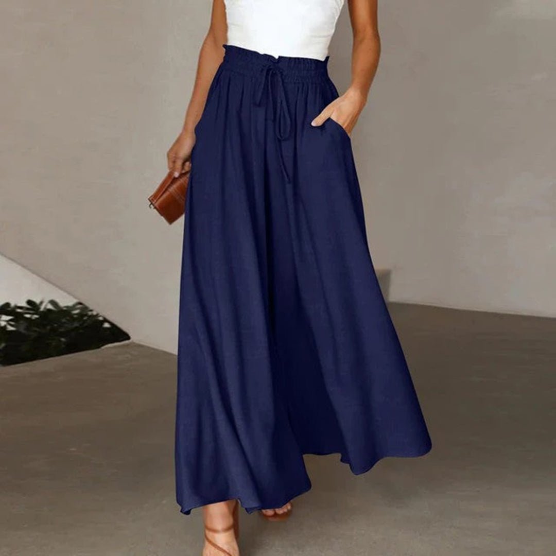 Women's wide leg pants featuring a high waist and drawstring tie, designed in a lightweight and breathable palazzo style, perfect for comfort and effortless elegance. 0